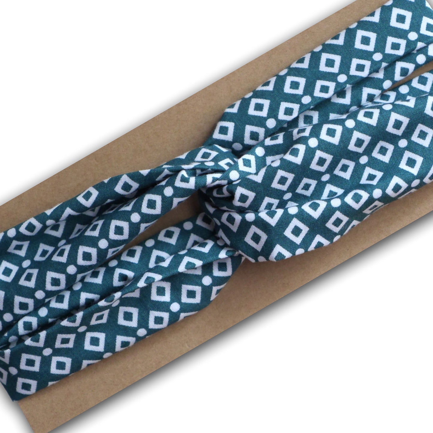 Headband bandeau cheveux élastiqué twisté tissu graphique losanges sur fond bleu vert